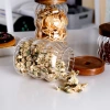Creative coarse grain glass storage jar, hammer-patterned acacia wood lid sealed jar, coffee bean storage jar and storage bottle Application Scenario